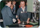 Ken Newton demonstrates the assembly machine